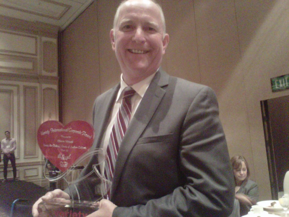 Rick Olson, President of Olson Visual, with a 2013 Variety International Corporate Award.