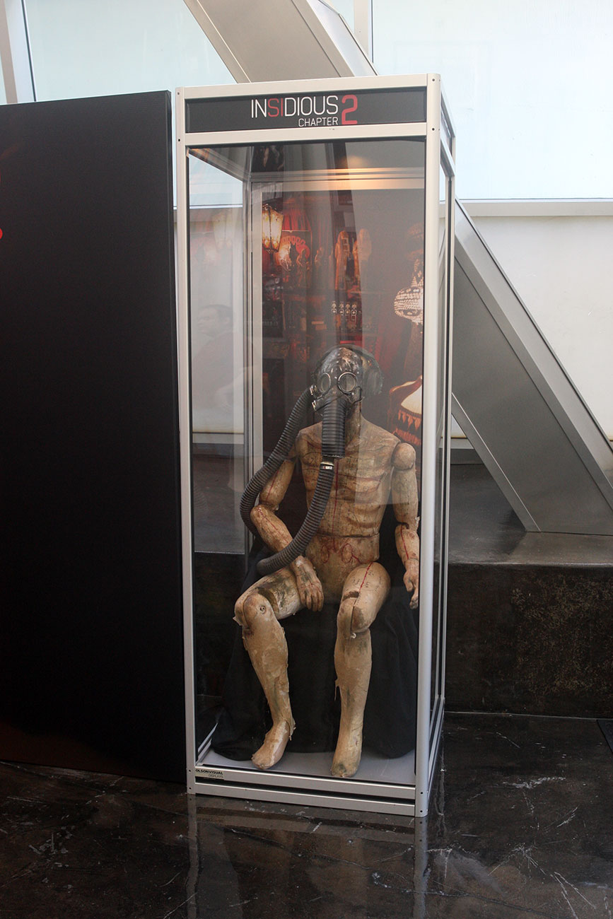 A close look at the gas mask prop strikingly displayed at the ArcLight Hollywood for Film District's INSIDIUS: CHAPTER 2.