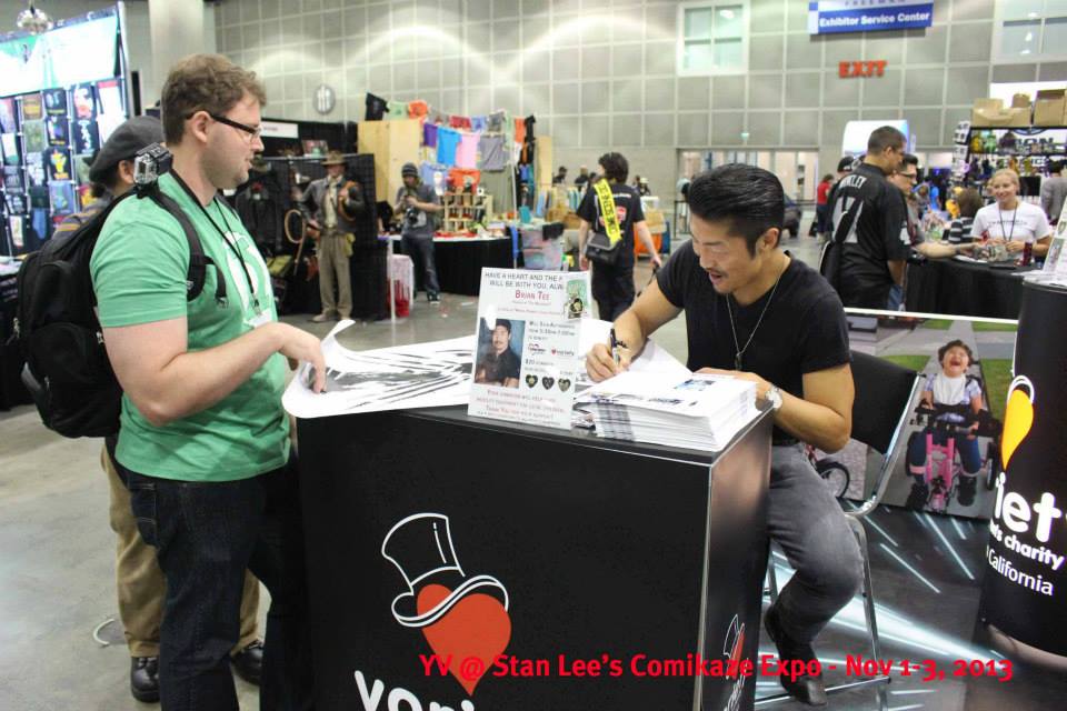 Actor Brian Tee from WOLVERINE signing autographs at the Young Variety of Southern California booth.